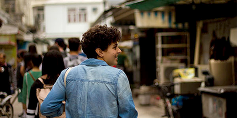 Student walking through a market abroad