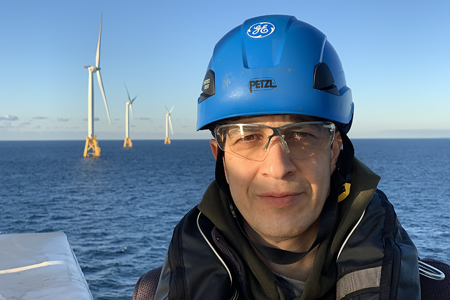 Masoud Sanayei near an offshore wind turbine