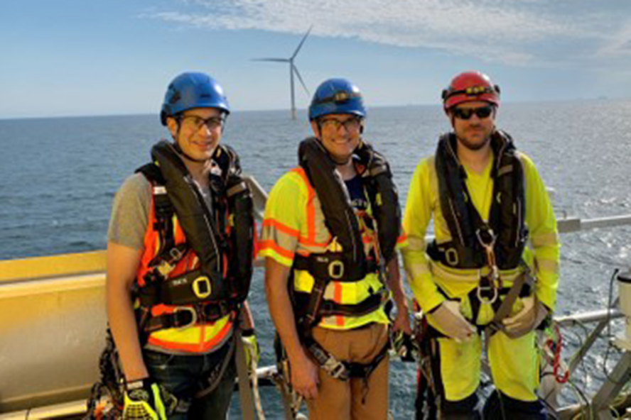 Masoud Sanayei and colleagues near an offshore wind turbine