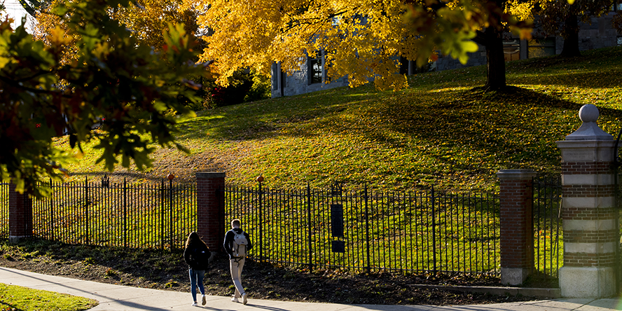 Students walk together through campus