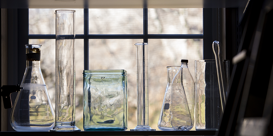 Beakers in front of a window