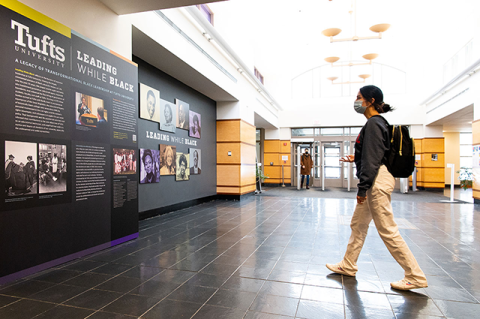 A student checks out the LWB exhibit in Tisch Library