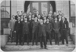 Founding trustees standing on steps