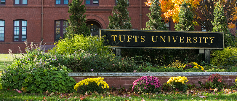 Tufts sign surrounded by bushes