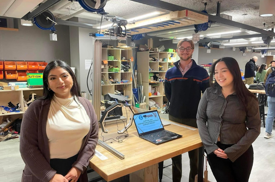 Migdalia Lopez, Lloyd Padgett, and Catreena Wang, posing for a picture amid their capstone project.