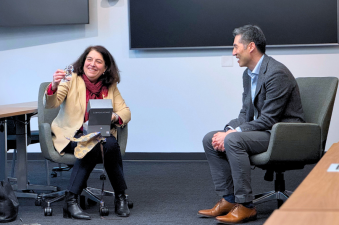 Karin Shepardson accepting a crystal elephant from Kyongbum Lee