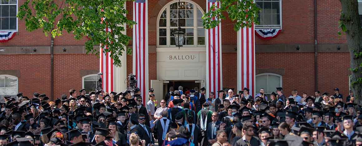 Procession walks back into Ballou Hall at Commencement 2022