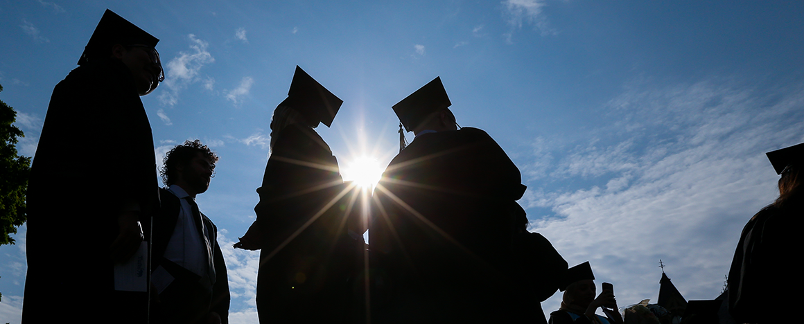 Silhouettes of graduating students