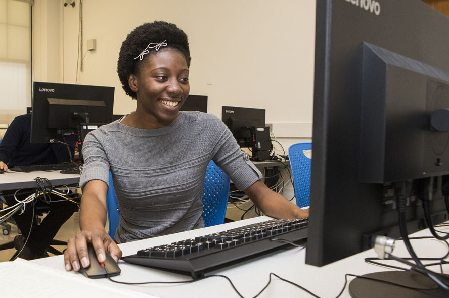 Computer Science doctoral student Monsurat Olaosebikan working on a computer