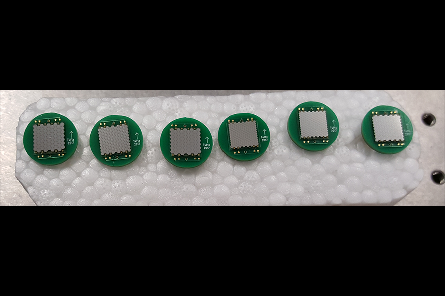 A set of the Tufts MEMS transducer arrays mounted on printed circuit boards.