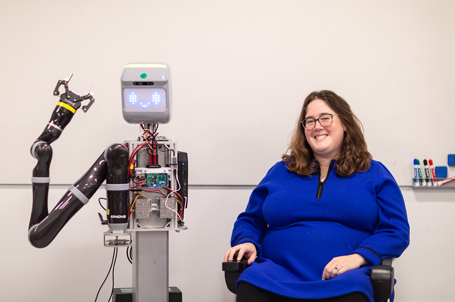 Clare Boothe Luce Assistant Professor Elaine Schaertl Short with a robot in her lab.