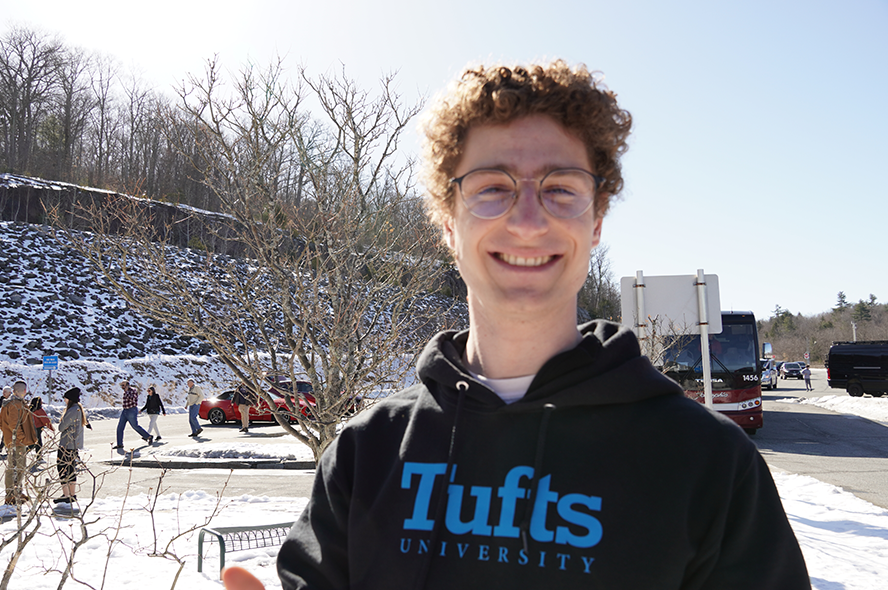 Noah Stiegler wearing a Tufts sweatshirt. 