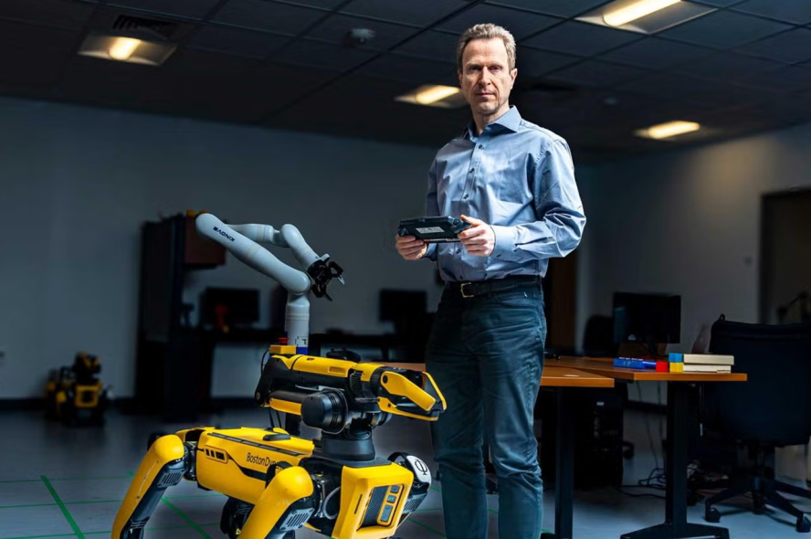 Matthias Scheutz controls a robot in the lab.