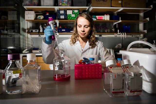 Assistant Professor Madeleine Oudin at work in her lab