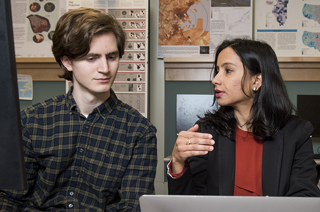 Matthew Bliss and Professor Rajput talk in front of a computer