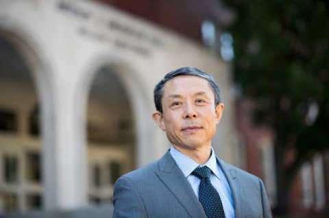 Dean Jianmin Qu outside the Science and Engineering Complex