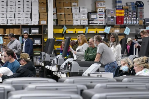 Election judges demonstrate the accuracy voting equipment in late October in Minneapolis. “There remains a need to make future elections still more secure,” says Josephine Wolff. Photo: AP/Abbie Parr