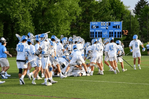The men’s lacrosse team celebrates their semifinal victory over Rochester Institute of Technology on May 21. Photo: Michael Last