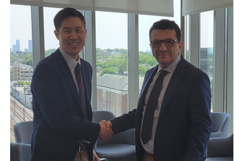 Kyongbum Lee, Karol Family Professor and Dean of Tufts School of Engineering, left, shakes hands with Francesco Svelto, Rector of the University of Pavia, right.