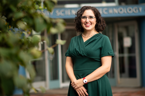 Associate Professor Ayse Asatekin standing outside the Science and Technology Center at Tufts.
