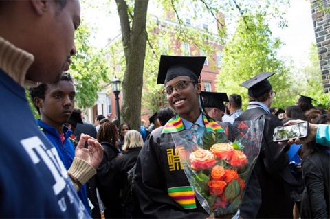 Abdisalan Mohamud, E17, celebrates with friends and family after graduating at Tufts University's 161st Commencement.