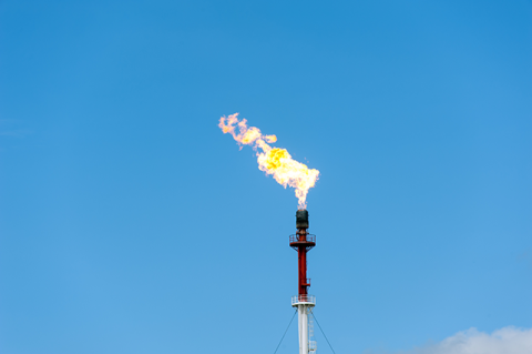 A methane flare in the blue sky