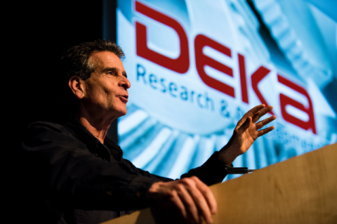 Dean Kamen stands at a podium.