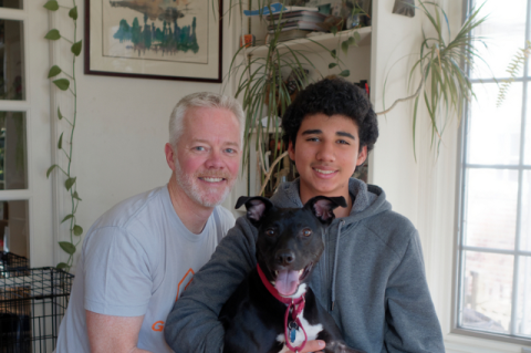 Alumnus Brian Eriksen with his son Nounn and their dog Tuck.