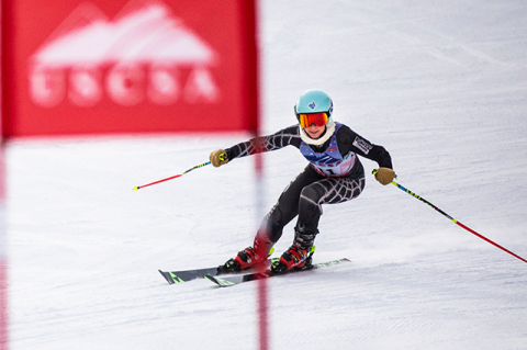 Sami Rubin turns a corner around a flag while competing in a giant slalom race