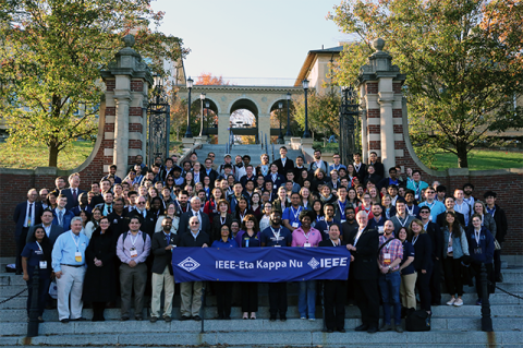 Conference attendees in a group photo on the Memorial Steps