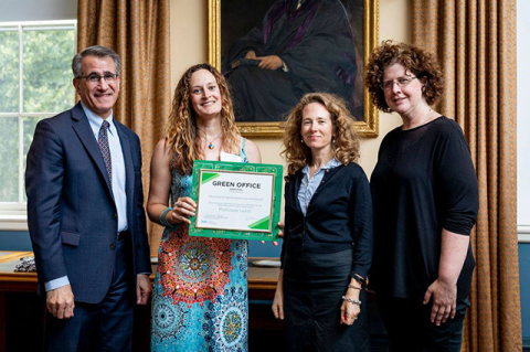 Members of the Center for Engineering Education Outreach receive their award from President Monaco for environmental sustainable practices at Tufts University