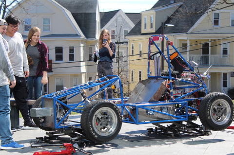 Students working on Tufts Electric Racing car