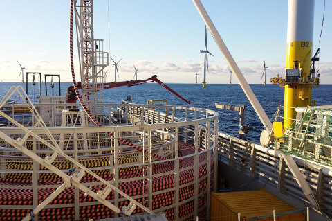 A cable-laying vessel lays cable for an offshore wind farm. Photo: Shutterstock