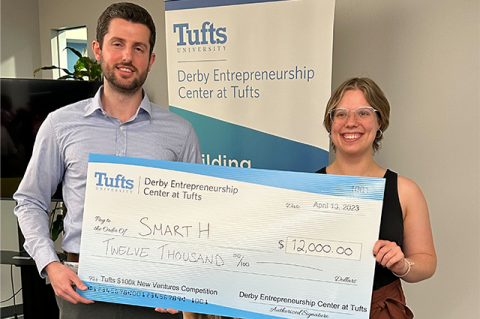 PhD student in chemical engineering Luca Mazzaferro, EG23, and MS student in materials science and engineering Zosia Stafford, E22, hold a large check for their winning pitch at the Tufts $100K New Ventures Competition. Photo credit: Tufts Gordon Institute and Derby Entrepreneurship Center. 