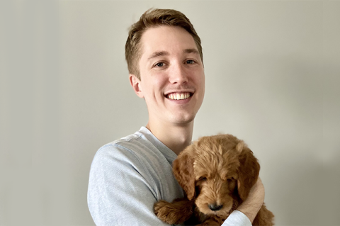 Alum Richard Preston holding a dog