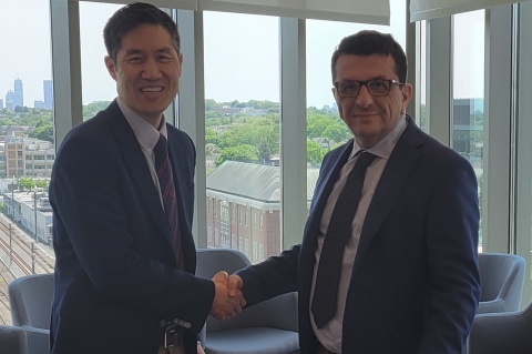 Kyongbum Lee, Karol Family Professor and Dean of Tufts School of Engineering, left, shakes hands with Francesco Svelto, Rector of the University of Pavia, right.